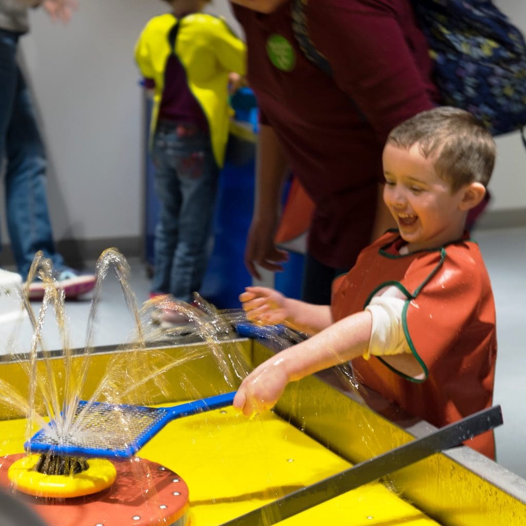 child playing at discovery museum