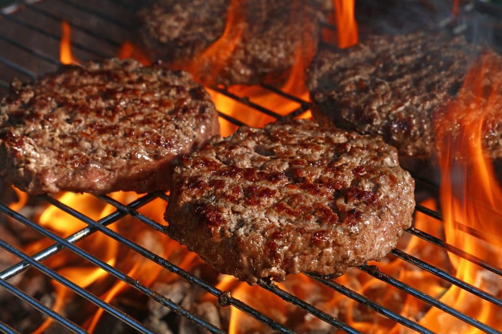 Beef burger for hamburger on barbecue flame grill